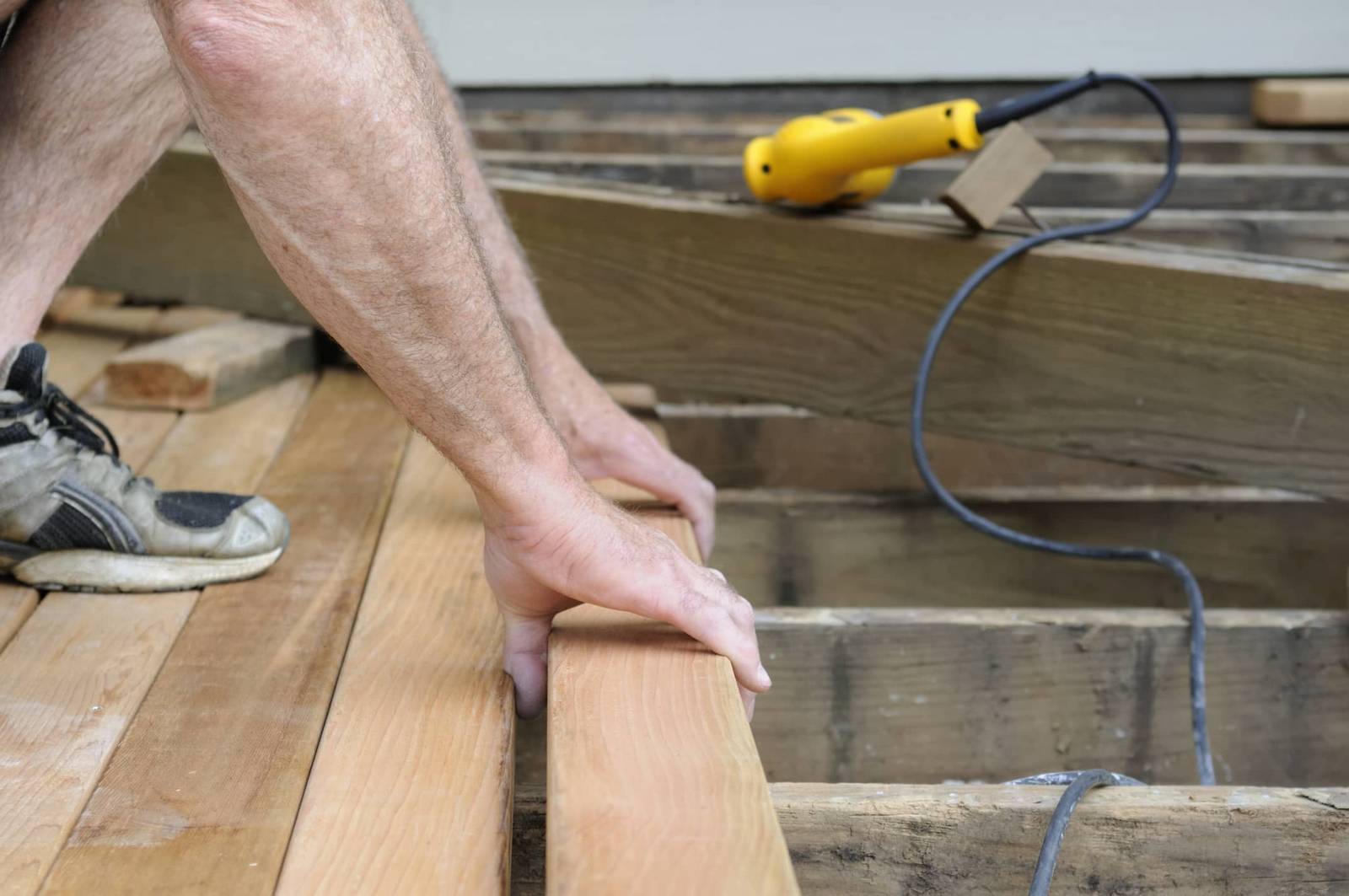 This is an image showing deck installation by a professional.